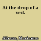 At the drop of a veil.